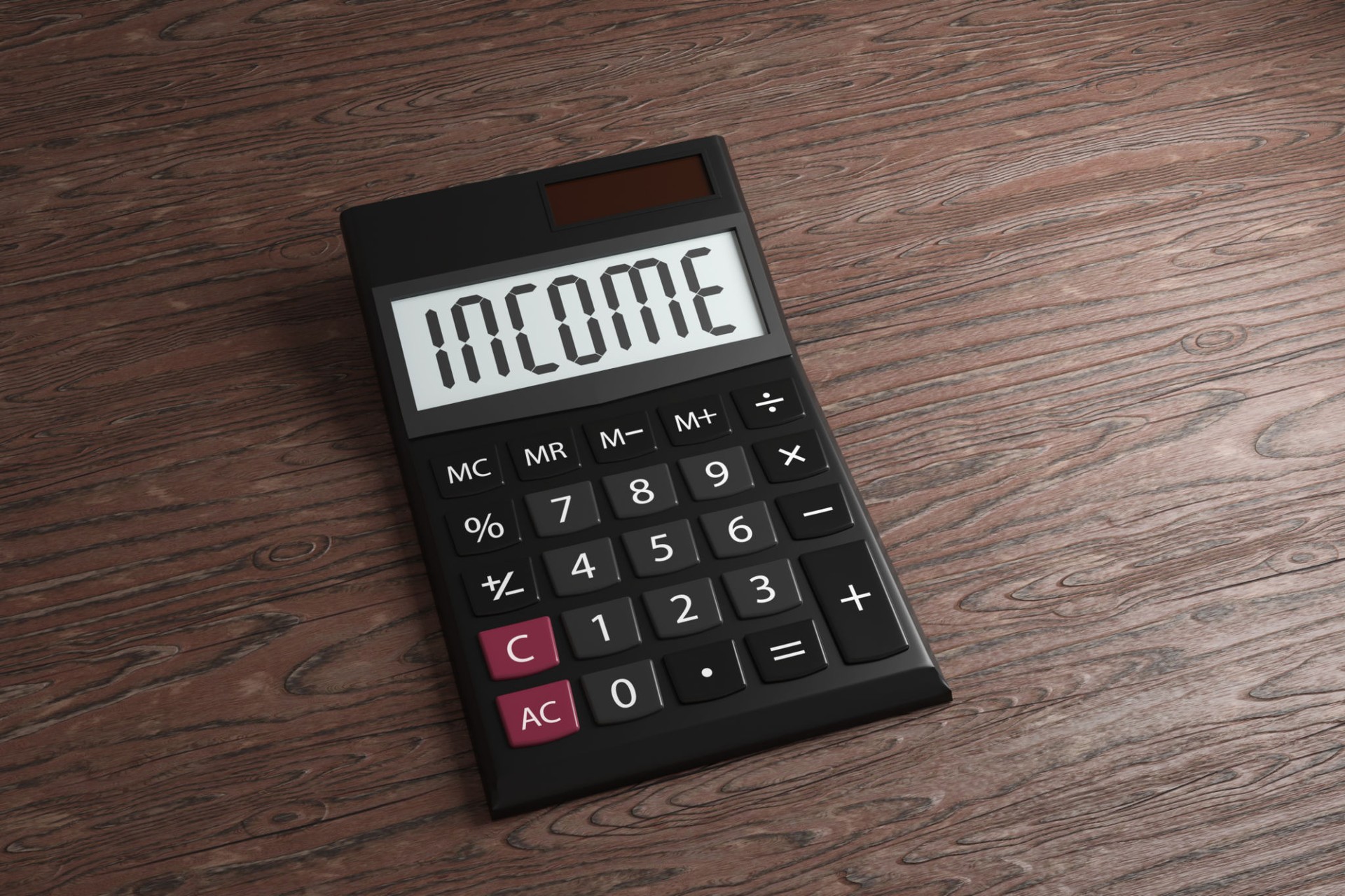 Black office calculator with its display showing the word INCOME on a wooden table. Illustration of the concept of personal earnings, employee salary and business revenue